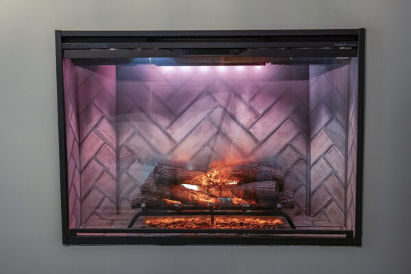 an electric fireplace with a brick herringbone interior