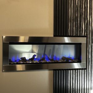 see through electric fireplace with a stainless steel frame and dark gray and marble colored acoustic wall panels