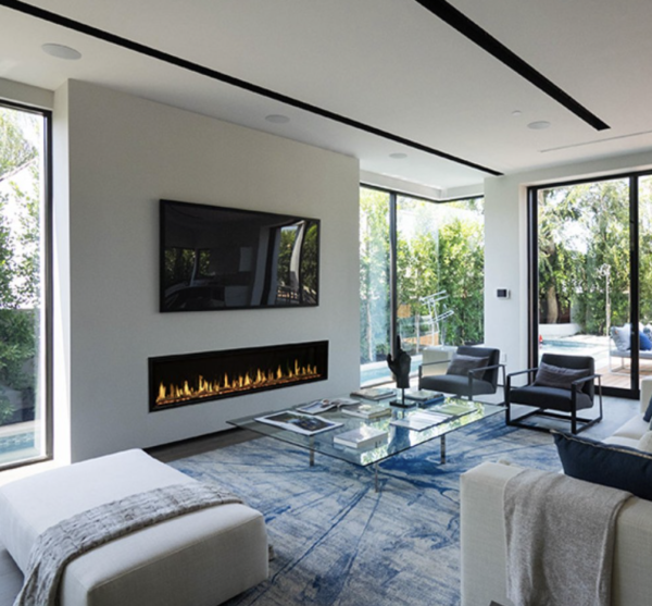 a modern flames orion multi 100 inch electric fireplace in a living room under a large tv