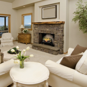 electric log set in a stone fireplace in a living room with light colored furniture