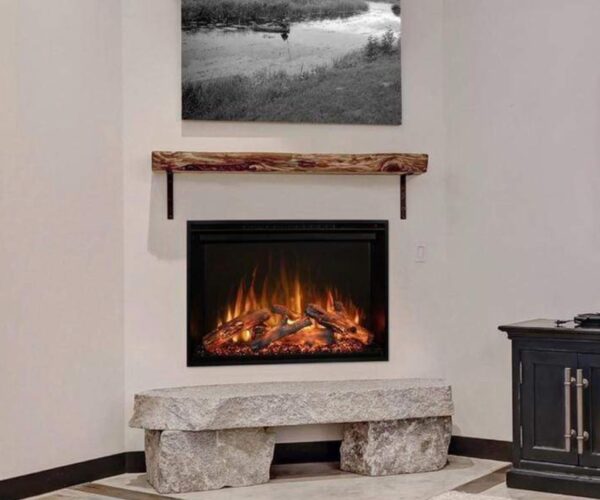 photo of modern flames redstone 36" electric fireplace installed in a white wall with a wood mantel and art above the mantel